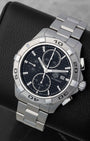 Front angled view of a stainless steel TAG Heuer Aquaracer 300M automatic chronograph men's watch in Dallas