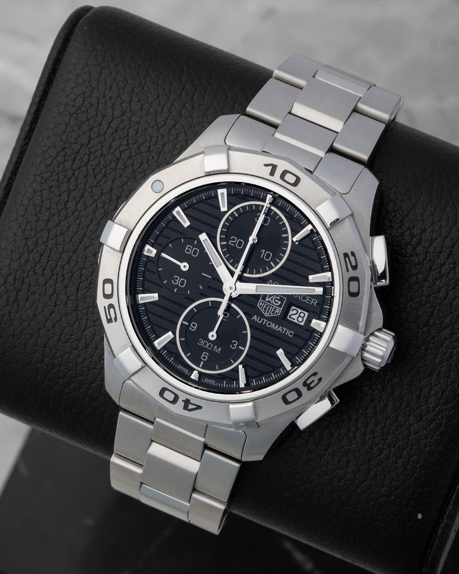 Front angled view of a stainless steel TAG Heuer Aquaracer 300M automatic chronograph men's watch in Dallas