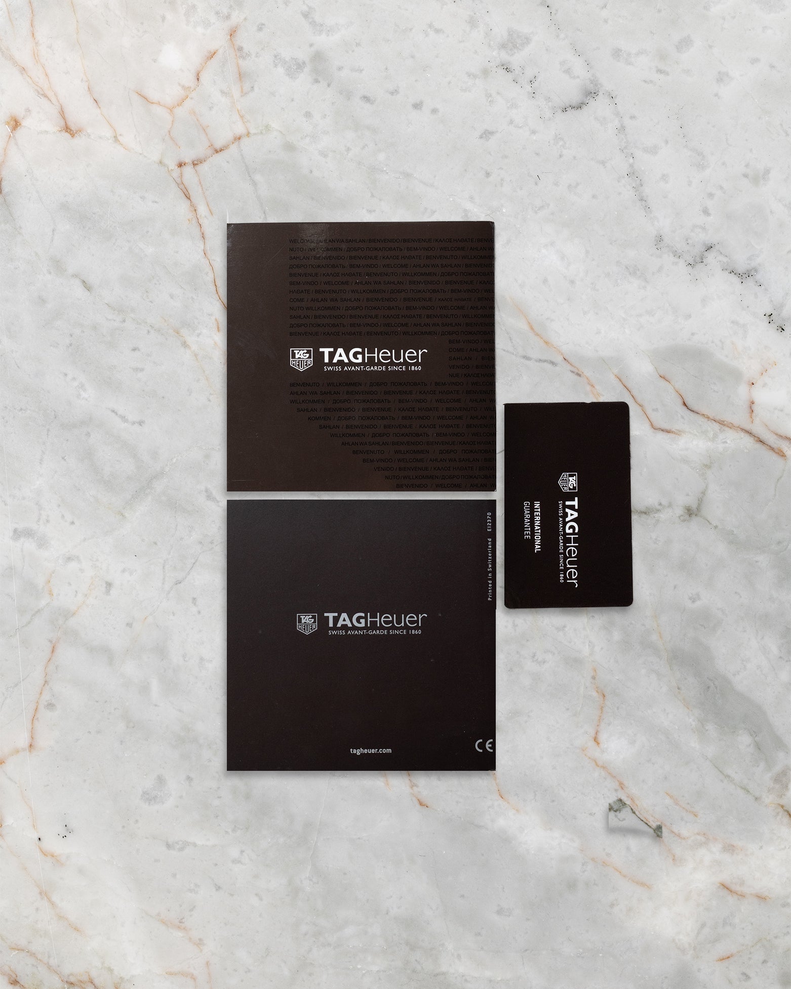 TAG Heuer Aquaracer reference CAP2110 official warranty card and instructional booklets at Noah's Fine Watches & Jewelry