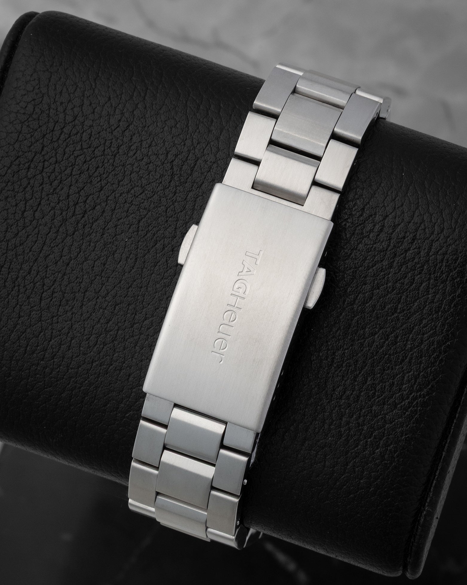 TAG Heuer stainless steel three-row watch bracelet and folding deployment clasp with safety latch