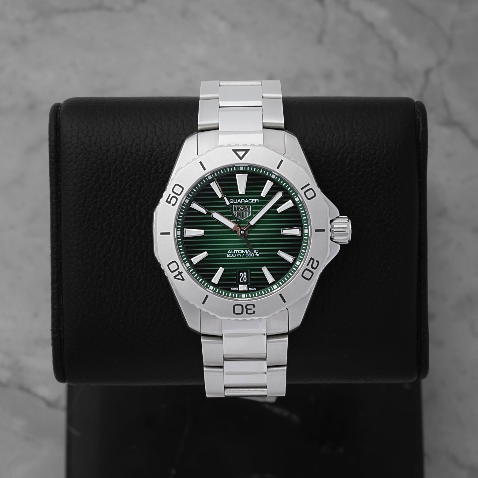 TAG Heuer Aquaracer Professional 200 Date WBP2115.BA0627 featuring a smoky green dial on a black display stand