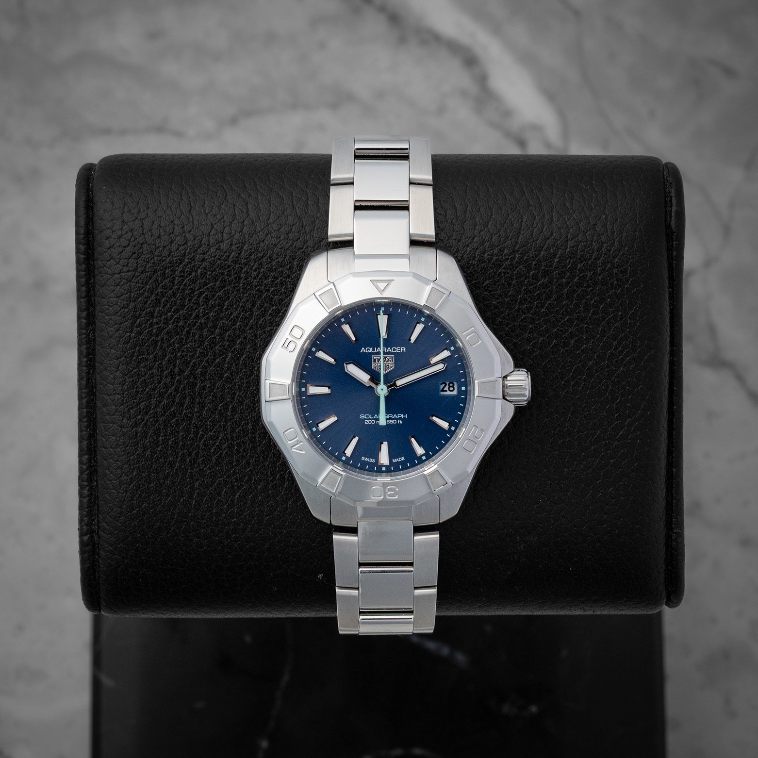 TAG Heuer Aquaracer Professional 200 Solargraph 34mm watch with a blue dial, model WBP1311, on display at Noah's Fine Watches & Jewelry in Dallas