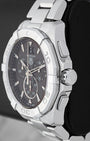 Right side profile view highlighting the screw-down crown, chronograph pushers, and engraved steel unidirectional bezel on a TAG Heuer Aquaracer CAY1110
