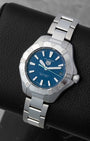 Front angled view of a stainless steel TAG Heuer Aquaracer Solargraph blue dial solar-powered quartz watch in Dallas