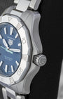Right side profile view highlighting the screw-down crown and three-row steel bezel of the TAG Heuer Aquaracer Solargraph WBP1311