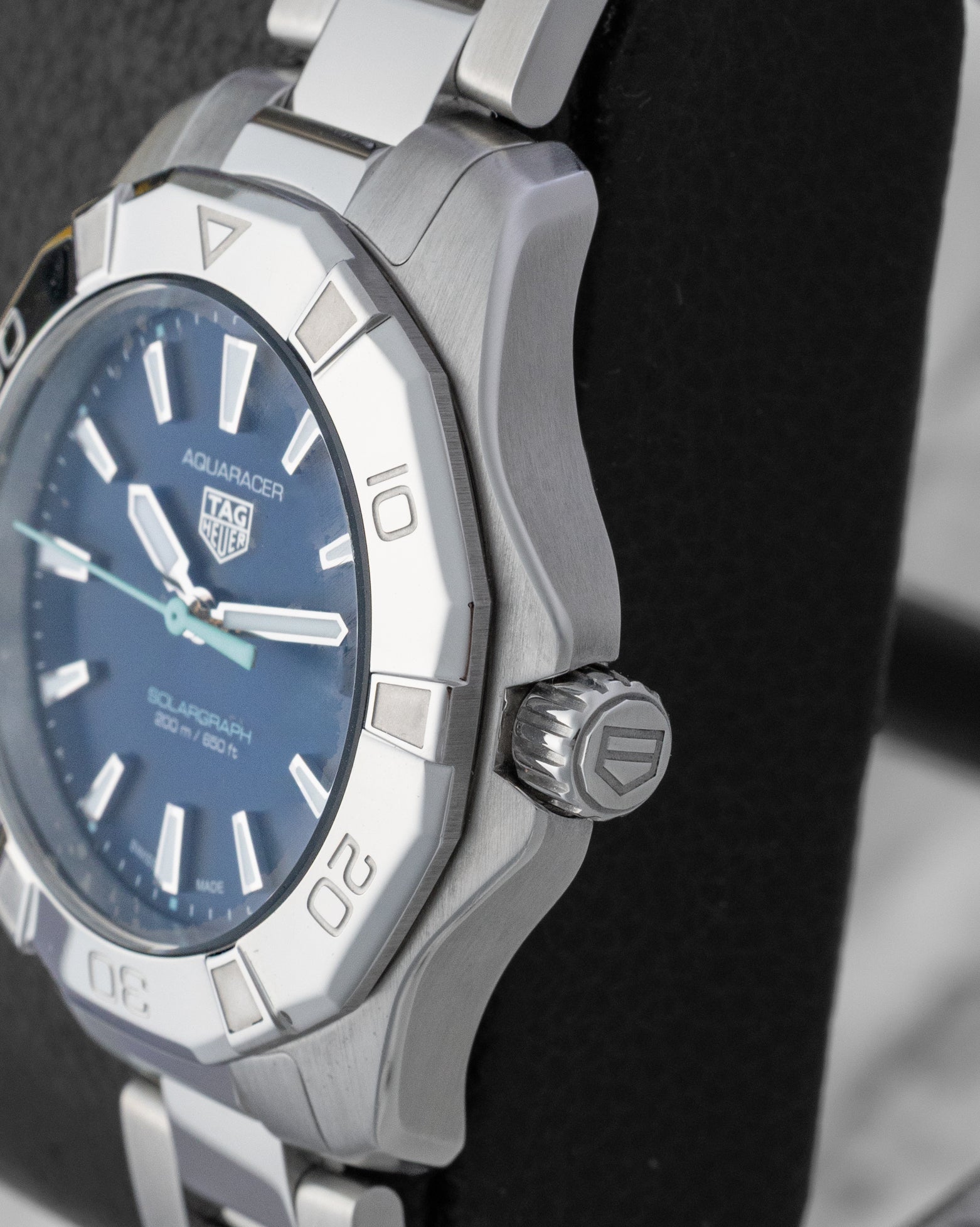 Right side profile view highlighting the screw-down crown and three-row steel bezel of the TAG Heuer Aquaracer Solargraph WBP1311