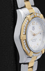 stainless steel left-side case profile view of a pre-owned 27mm ladies TAG Heuer Aquaracer sports watch resting on a presentation block