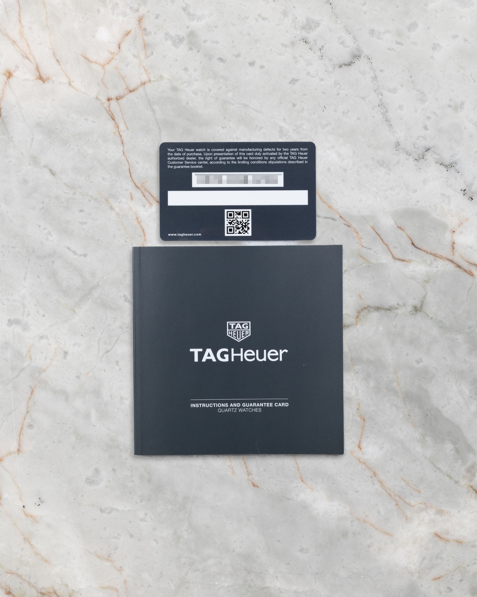 TAG Heuer Aquaracer reference WAY1111 official warranty card and booklet at Noah's Fine Watches & Jewelry