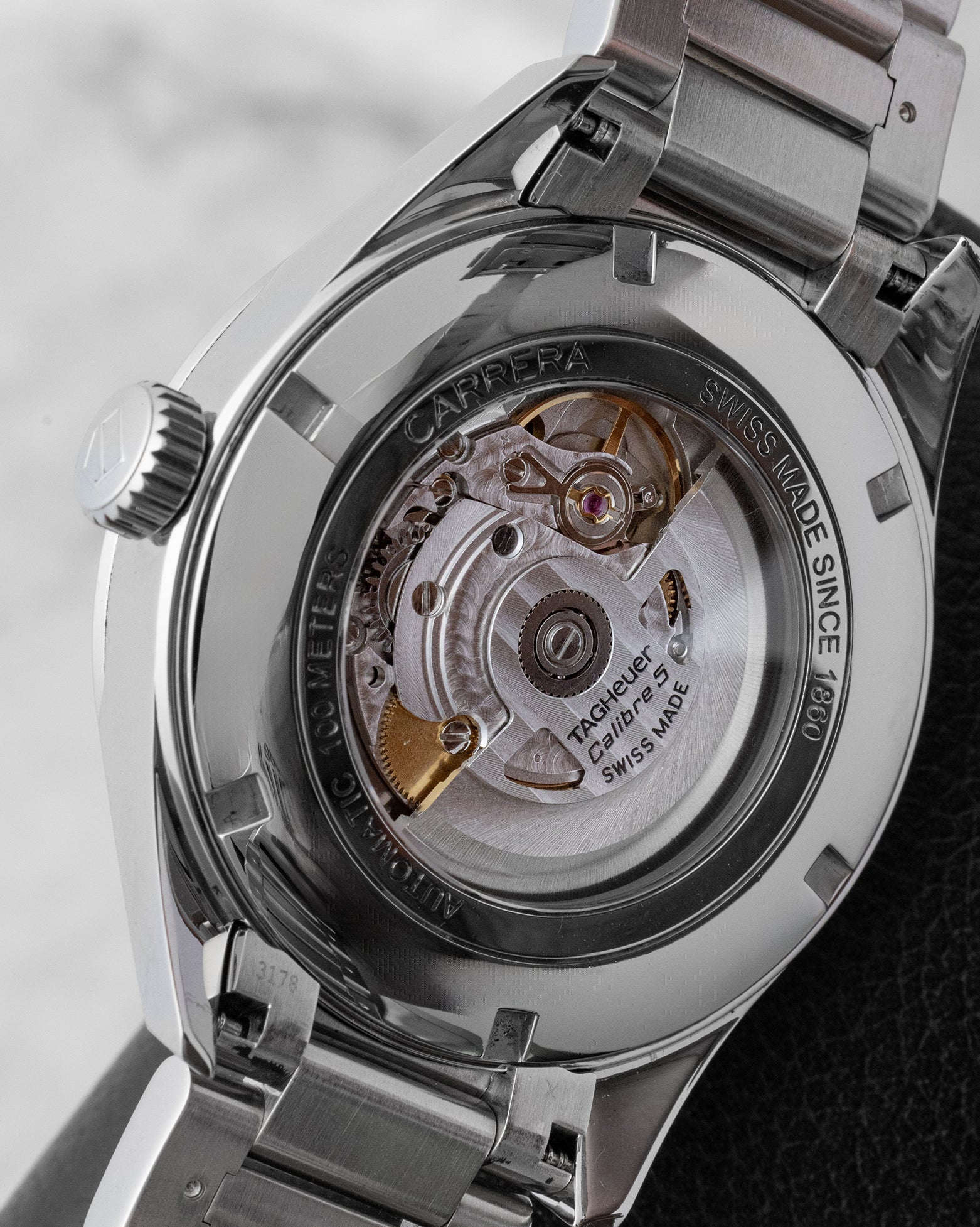 The sapphire crystal exhibition caseback of a TAG Heuer Carrera displaying the Swiss automatic Calibre 5 movement and rotor