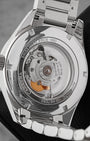 The reverse chassis profile through a sapphire exhibition window revealing the Swiss automatic Calibre 5 movement decorated with Geneva stripes and a gold-engraved rotor weight