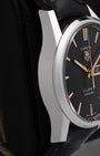 Left side profile of the stainless steel watch chassis highlighting the fine satin-brushed case band finishing and the elegant, ergonomic signature Carrera H-shaped lugs