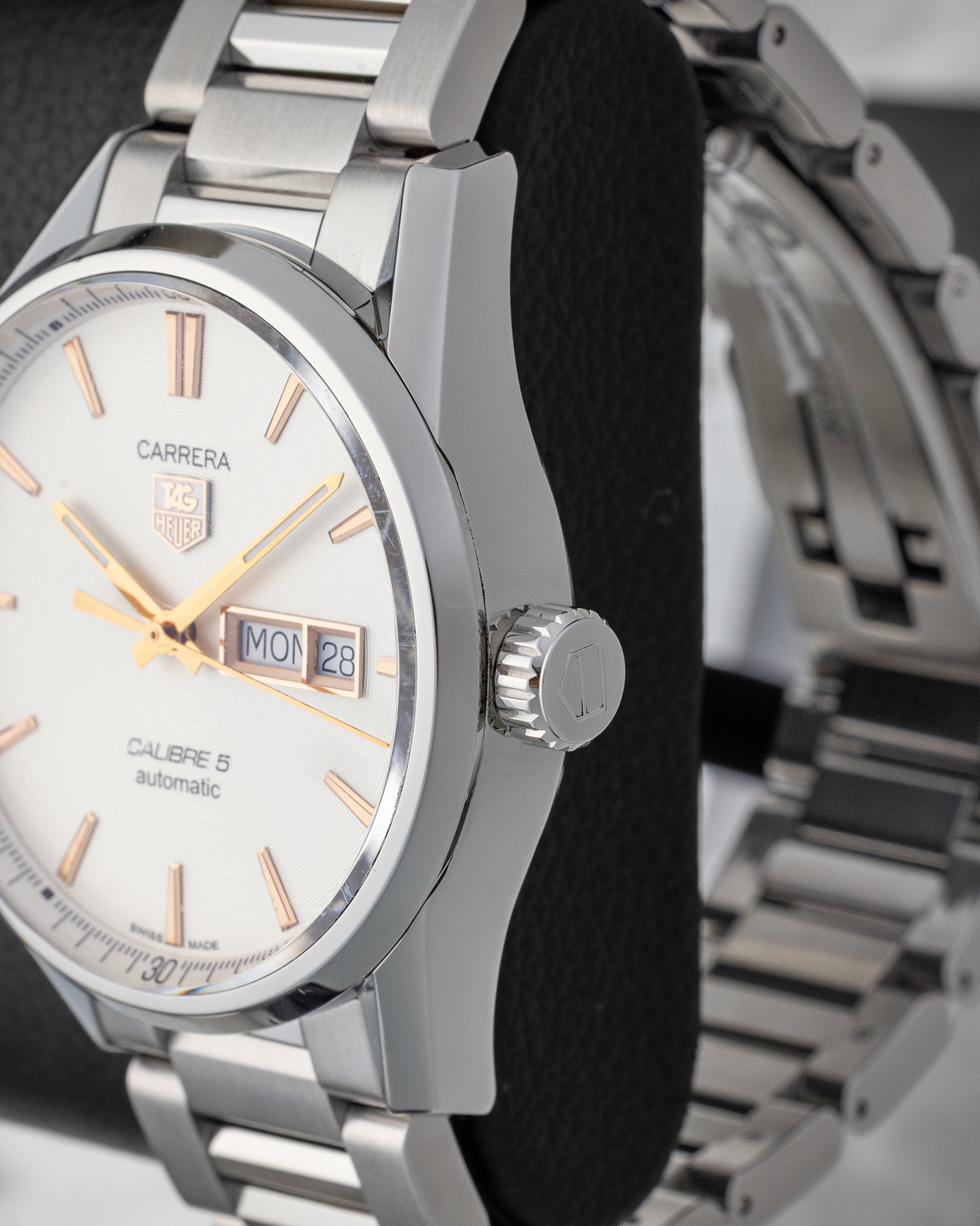 Side profile view of the stainless steel case and signed fluted crown of a TAG Heuer Carrera Calibre 5 watch