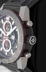 Close-up right profile view of the 45mm titanium Carrera case showing the red-accented chronograph pushers and rubber-gripped crown