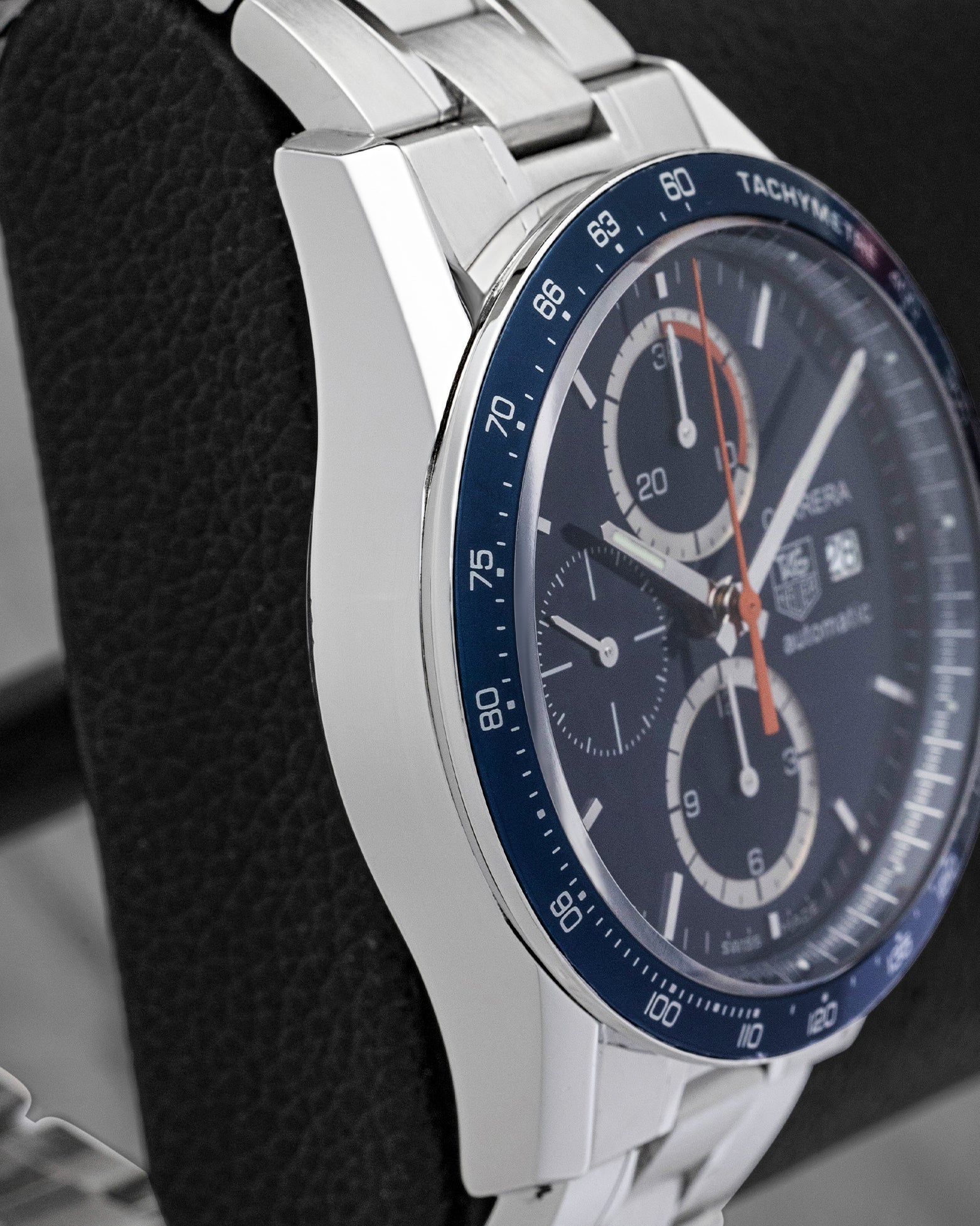 Polished stainless steel case profile and blue aluminum bezel on pre-owned TAG Heuer Carrera Calibre 16