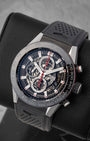 angled top-down studio overview of the skeletonized TAG Heuer Carrera watch highlighting its open-work dial and black ceramic bezel
