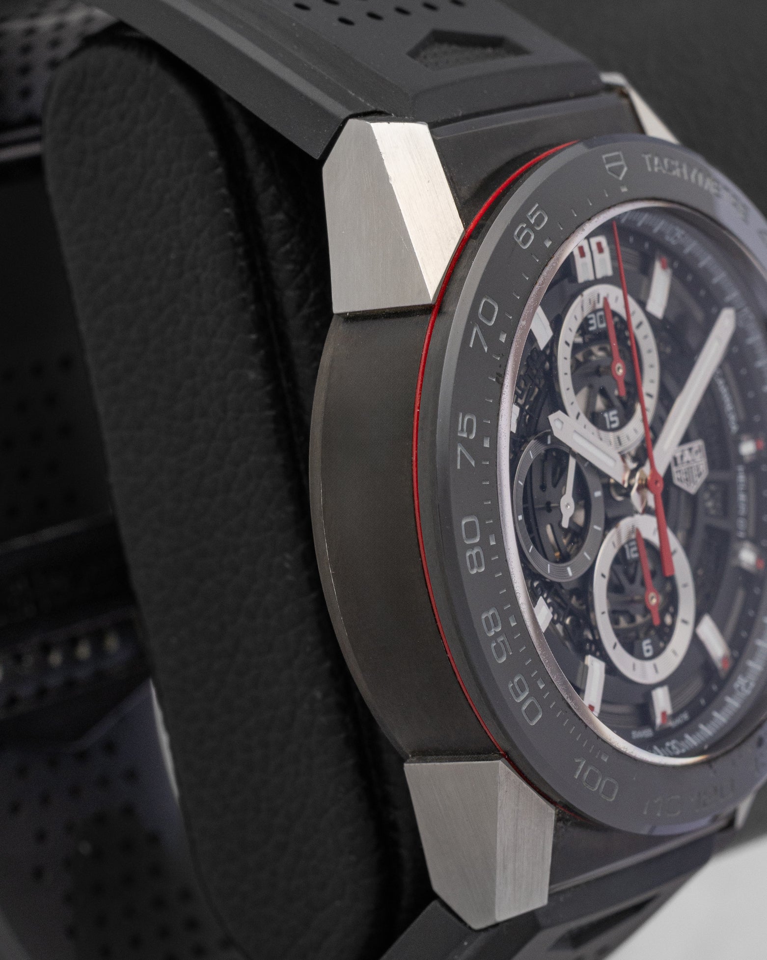 left non-crown profile view of the TAG Heuer Carrera skeleton watch highlighting the modular lug architecture and ceramic bezel rim