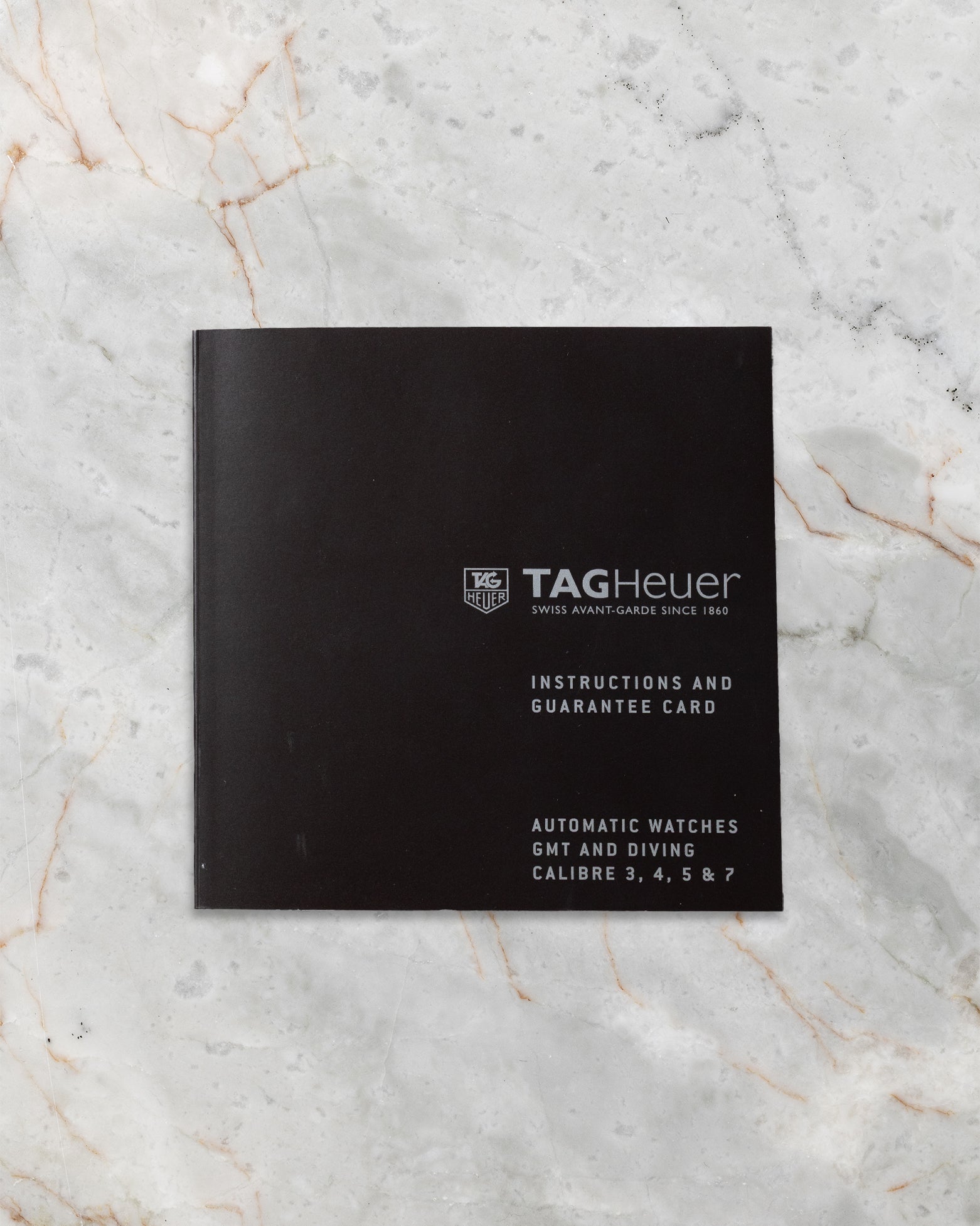 Official TAG Heuer user manual and guarantee booklet included with pre-owned Carrera WAR211A