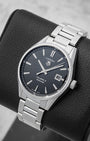 Angled view of 39mm TAG Heuer Carrera WAR211A.BA0782 showing black dial, date display, and stainless steel bezel