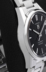 Polished stainless steel case profile and bezel view of pre-owned TAG Heuer Carrera Calibre 5 automatic