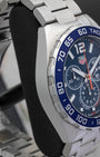 Left side case profile showcasing the fine-brushed stainless steel case finish of the 43mm TAG Heuer Formula 1 chronograph