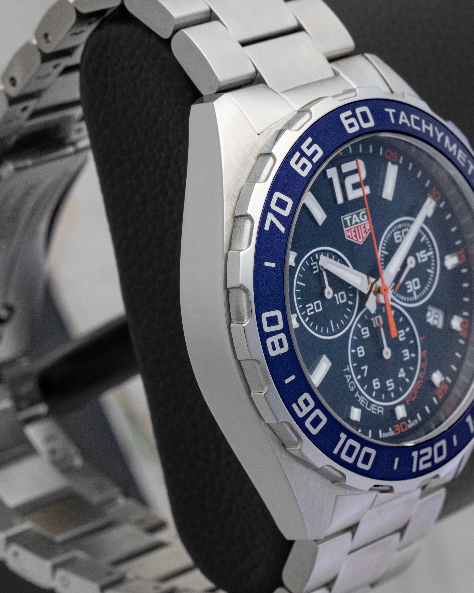 Left side case profile showcasing the fine-brushed stainless steel case finish of the 43mm TAG Heuer Formula 1 chronograph