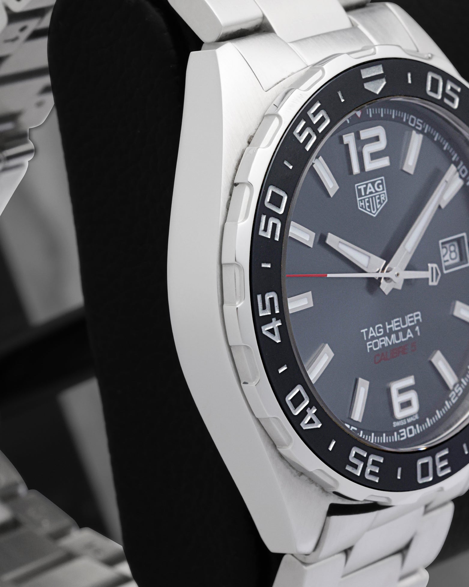 Side profile view of the polished and brushed stainless steel case on the non-crown side of a TAG Heuer Formula 1 Calibre 5 watch