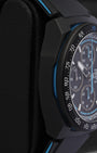 Side profile view of the non-crown side of a black DLC titanium TAG Heuer Formula 1 chronograph case on a display cushion