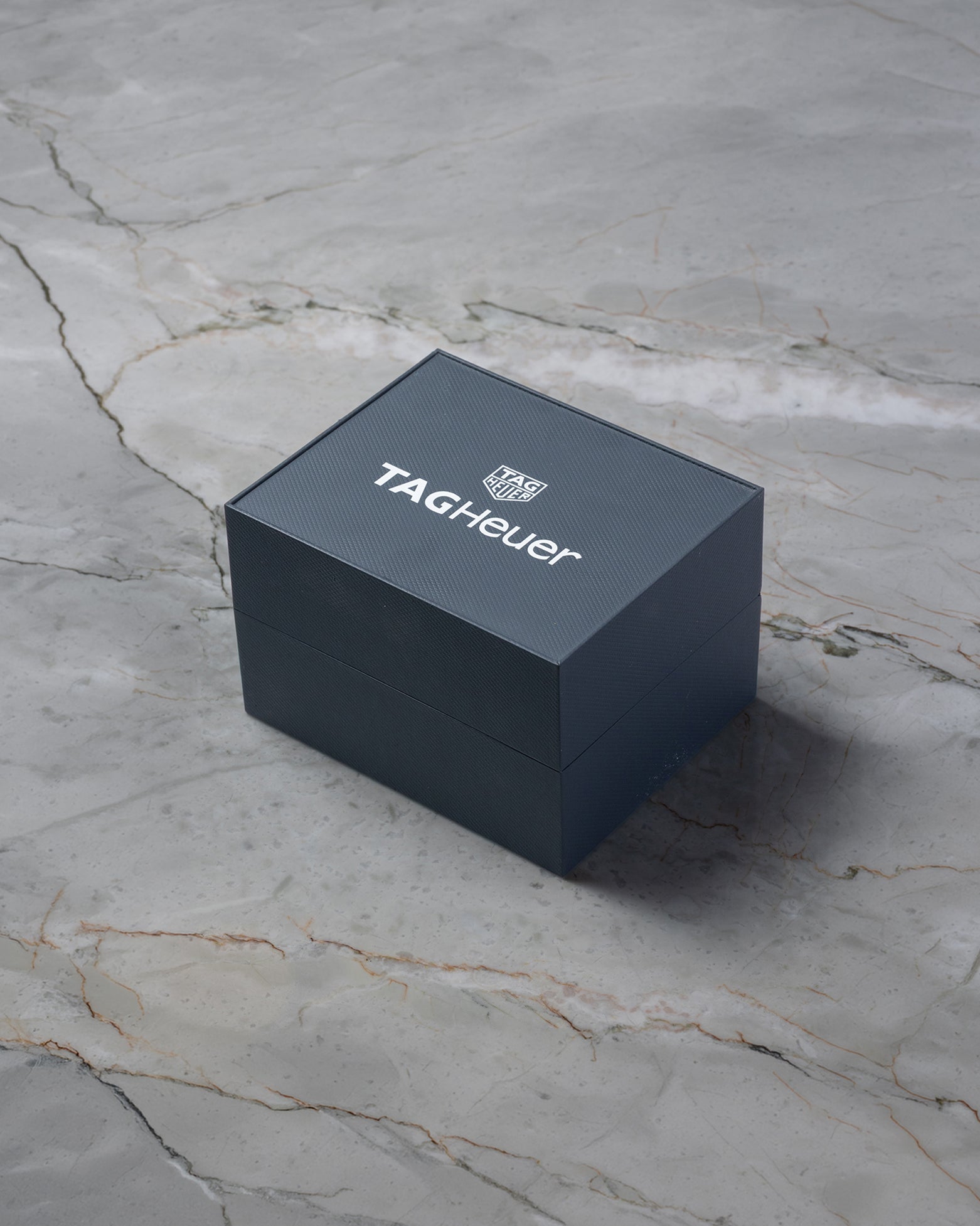 Dark blue TAG Heuer luxury watch presentation box on display