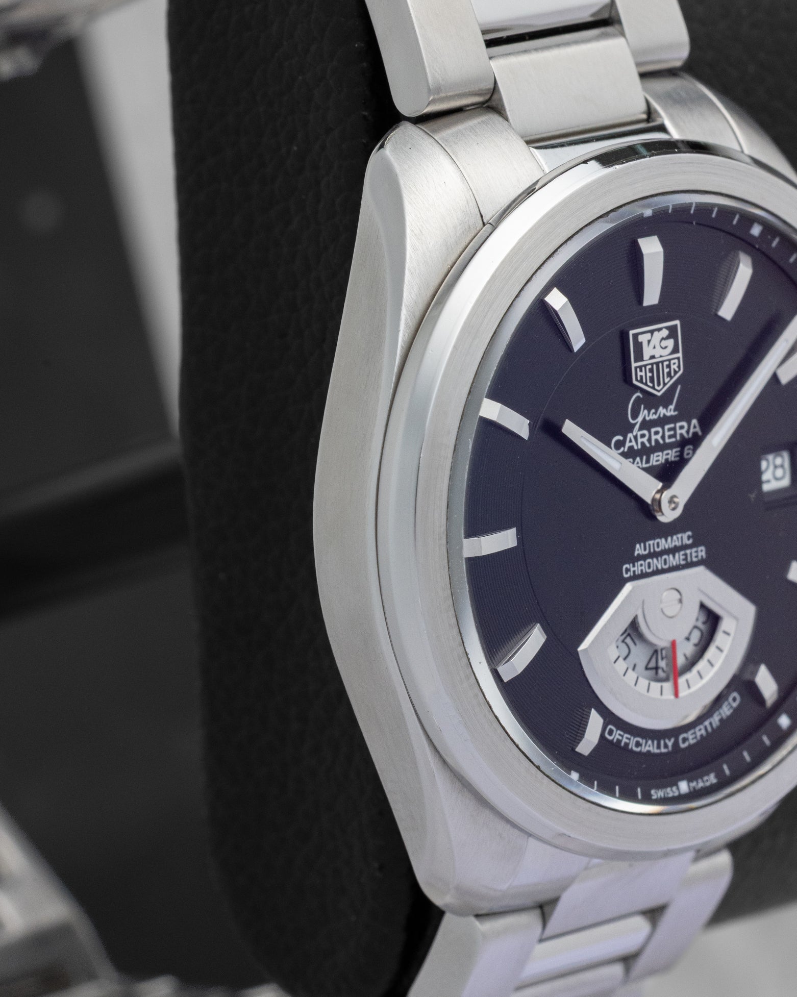Side profile view of the sculpted stainless steel case on the non-crown side of a TAG Heuer Grand Carrera Calibre 6 RS