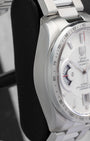 Side profile view of the brushed and polished stainless steel case on the non-crown side of a TAG Heuer Grand Carrera