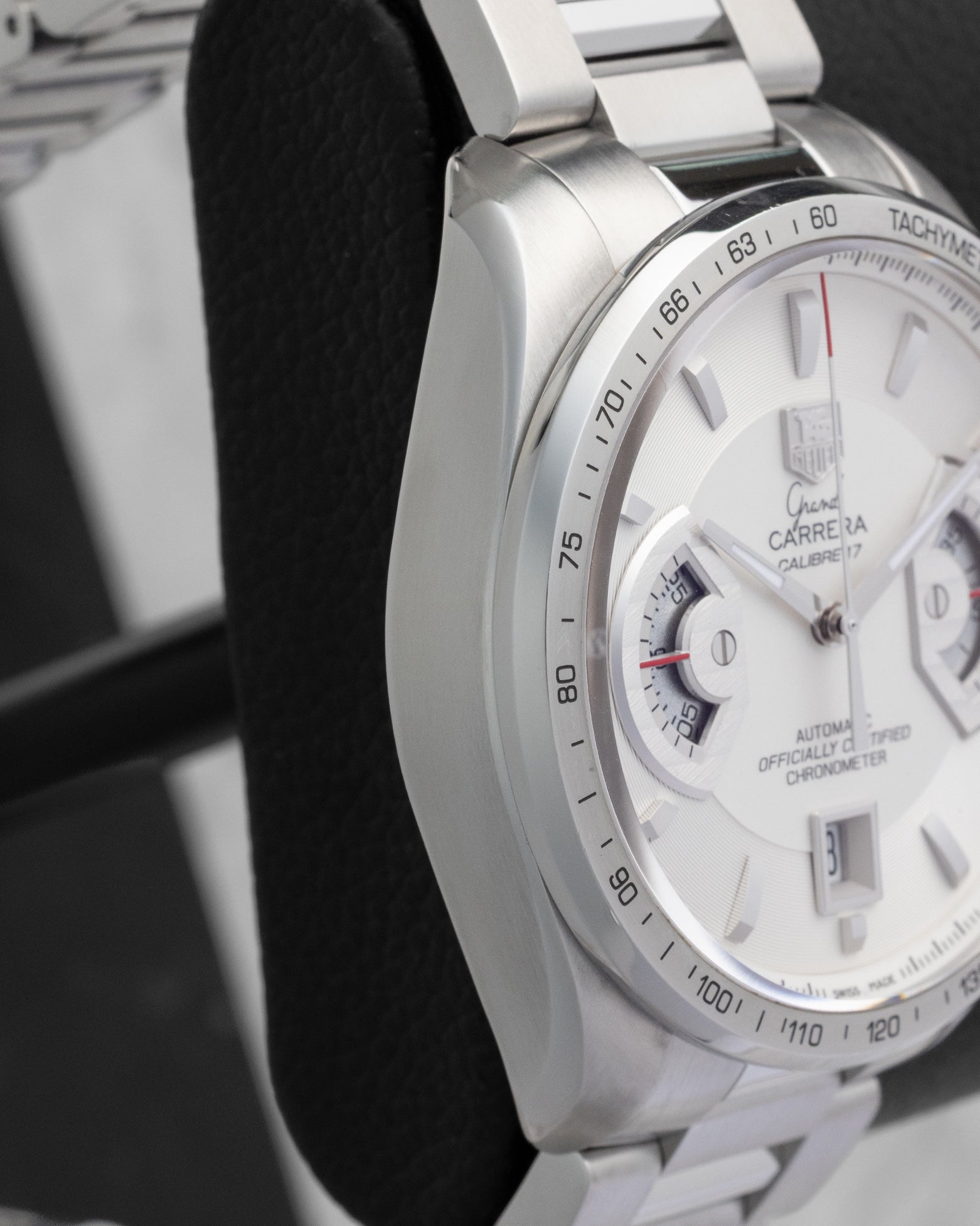 Side profile view of the brushed and polished stainless steel case on the non-crown side of a TAG Heuer Grand Carrera