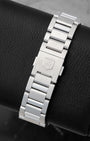 Rear studio view of the solid stainless steel link bracelet and push-button folding deployment clasp on a TAG Heuer Grand Carrera