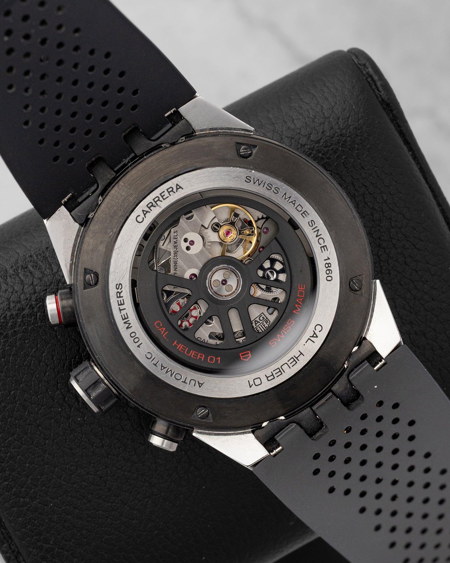 sapphire crystal display caseback of the Carrera watch revealing the skeletonized rotor and column-wheel mechanism of the Heuer 01 caliber
