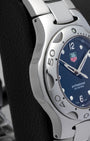 Left side profile showcasing the distinct liquid metal design and brushed finish of the integrated TAG Heuer Kirium case