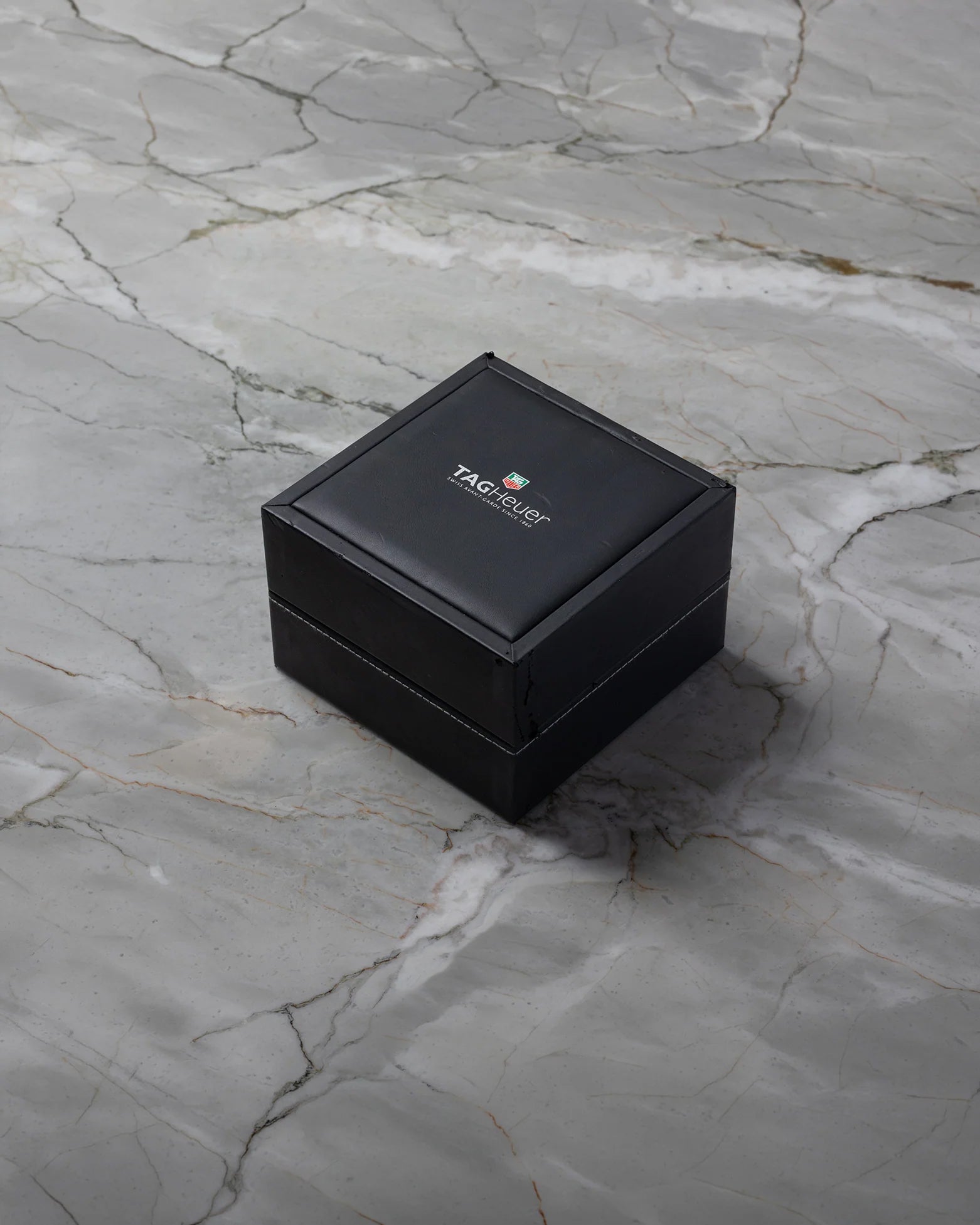 Square black TAG Heuer luxury watch presentation box on display