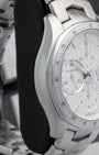 Side profile view of the polished and brushed stainless steel case on the non-crown side of a TAG Heuer Link chronograph