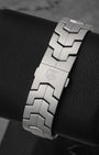 Rear view of the signature interlocking double-S link bracelet focusing on the flush, secure folding deployment buckle detailed with a laser-etched Heuer shield