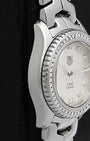 Left-side macro profile view showcasing the seamless, mirror-polished fluid transition from the stainless steel case side into the integrated signature S-link bracelet connection