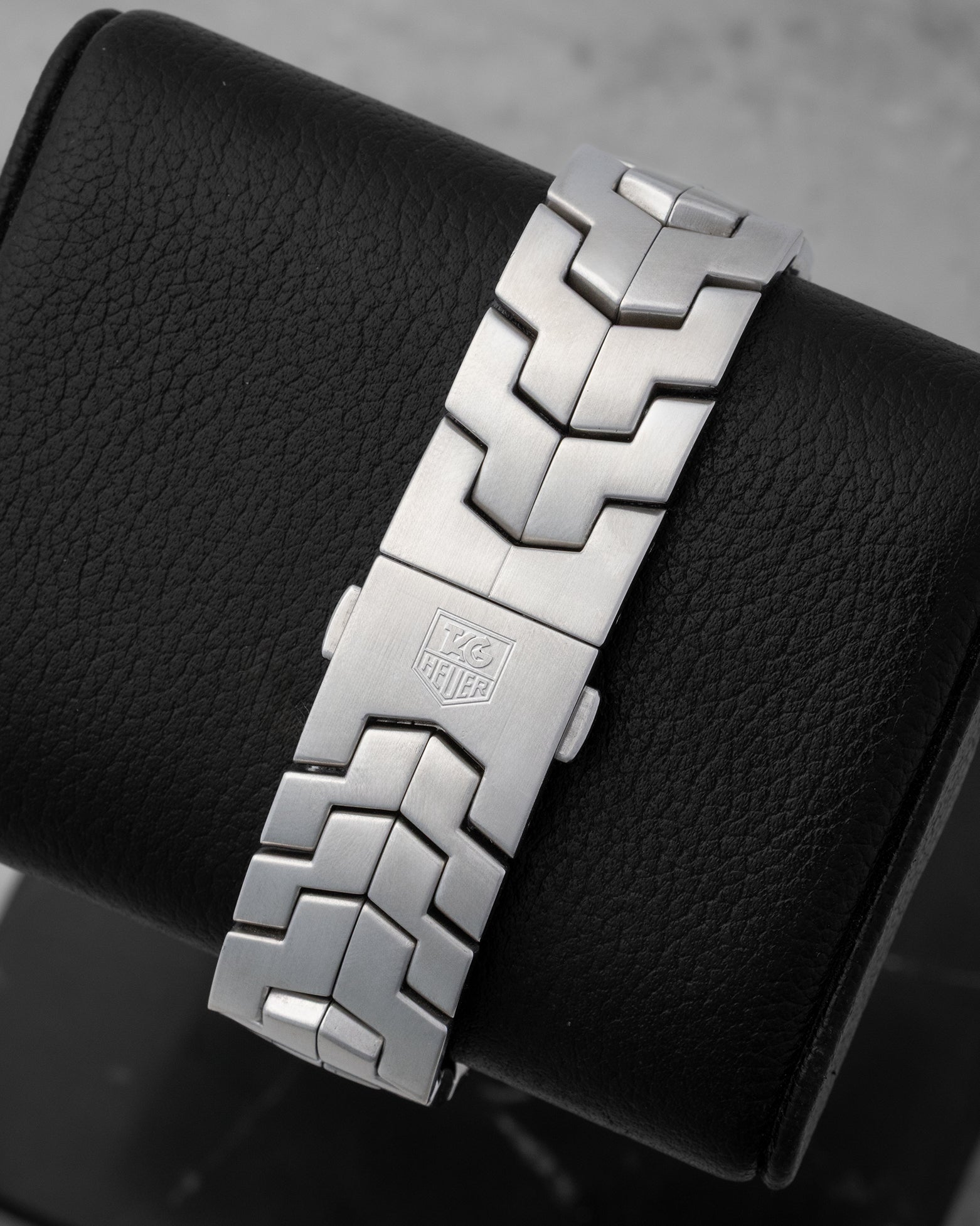 Rear studio view of the signature ergonomic stainless steel S-link bracelet and integrated folding deployment clasp