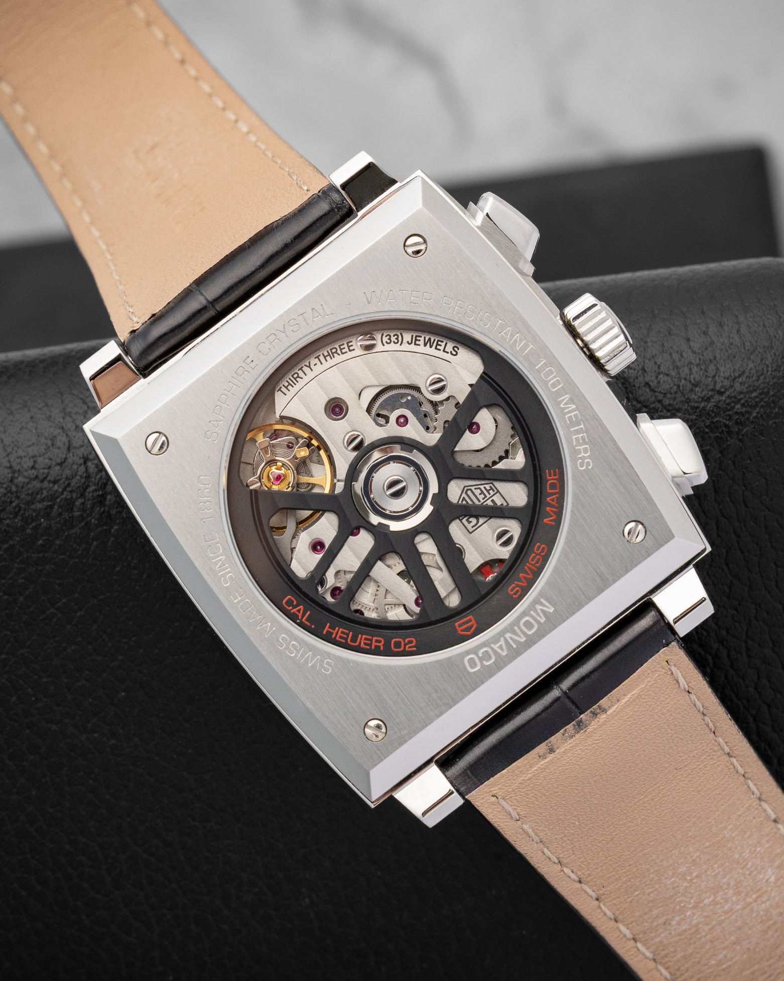 Sapphire exhibition case back revealing the in-house Calibre Heuer 02 automatic movement of TAG Heuer Monaco CBL2113.FC6177