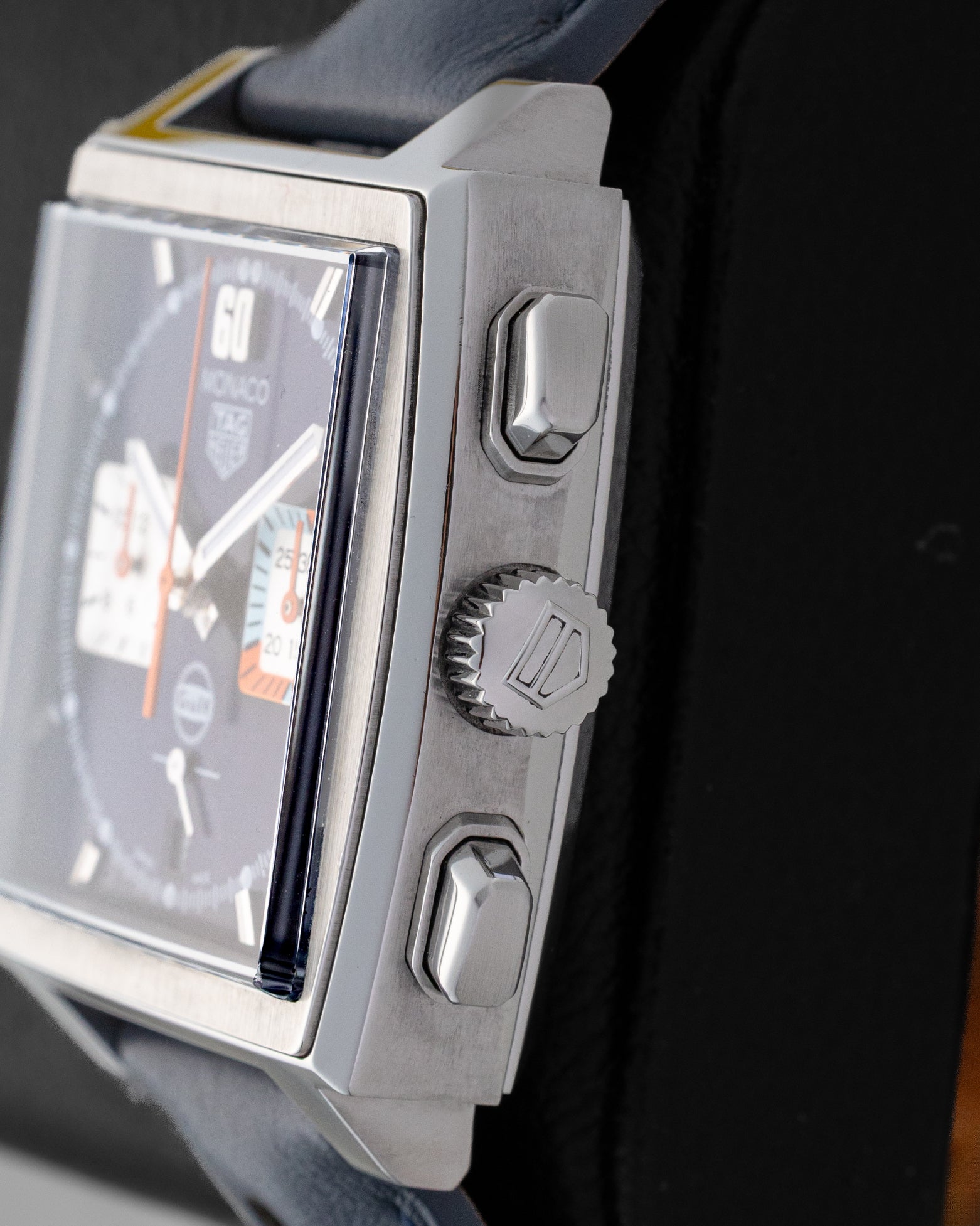 Right side profile view of the pre-owned TAG Heuer Monaco Gulf CBL2115.FC6494 featuring the winding crown, dual rectangular chronograph pushers, and bevelled sapphire crystal.