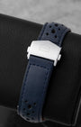 Blue perforated leather racing strap and polished stainless steel folding clasp with safety push-buttons for the TAG Heuer Monaco Gulf CBL2115.FC6494.