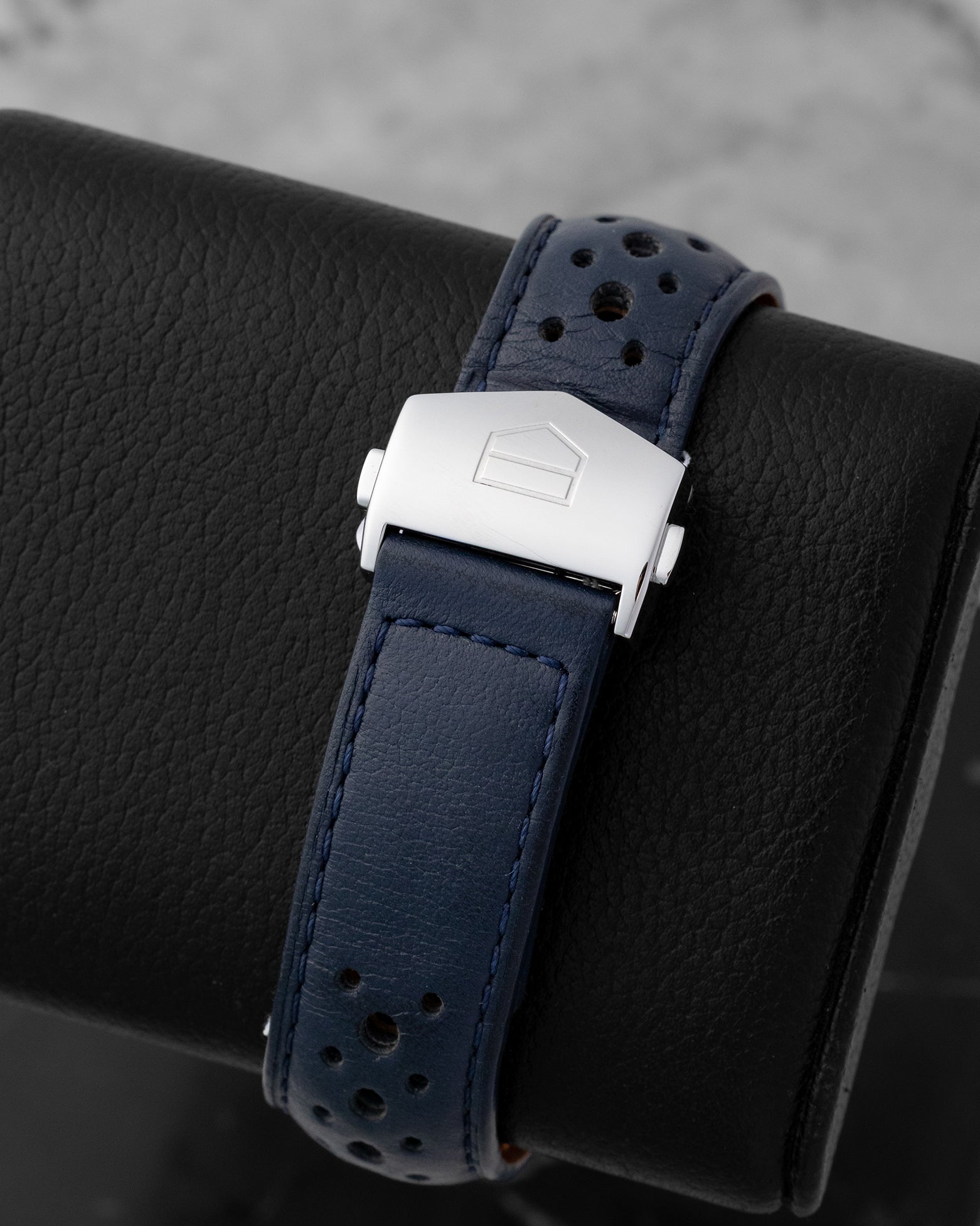 Blue perforated leather racing strap and polished stainless steel folding clasp with safety push-buttons for the TAG Heuer Monaco Gulf CBL2115.FC6494.