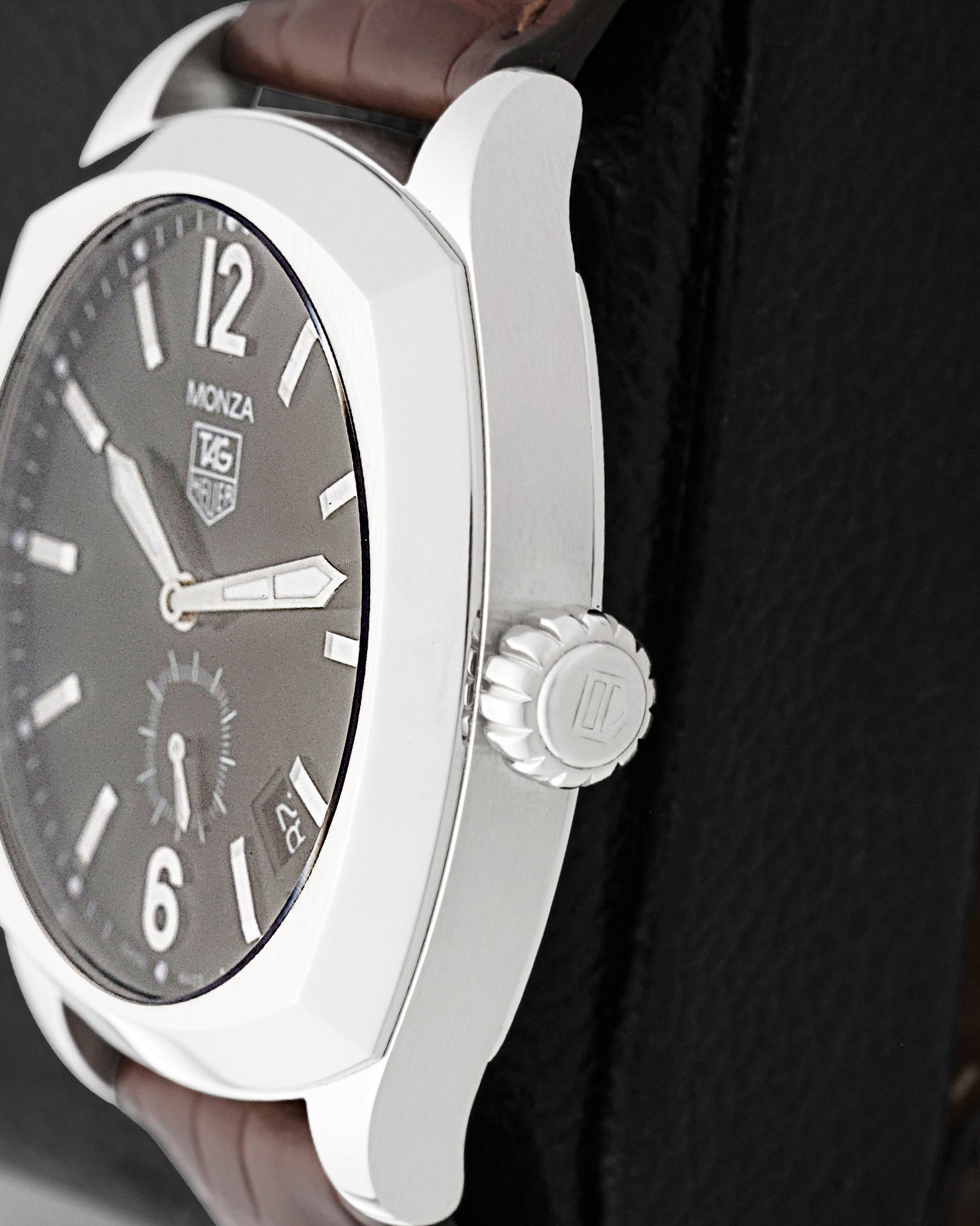 Close-up side view of the polished stainless steel cushion case and crown on a TAG Heuer Monza Calibre 6 WR2110