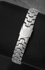 A rear view of the iconic ergonomic S-shaped metal link bracelet emphasizing the completely flush closure of the hidden bi-fold safety deployment clasp
