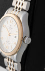 Right side profile view of the pre-owned 2024 Tudor 1926 M91351 polished steel case, smooth rose gold bezel, and steel screw-down crown with Tudor shield logo.