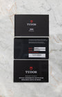 Original Tudor user manual, guarantee booklet, and official international warranty card for the pre-owned 2024 Tudor 1926 M91351.
