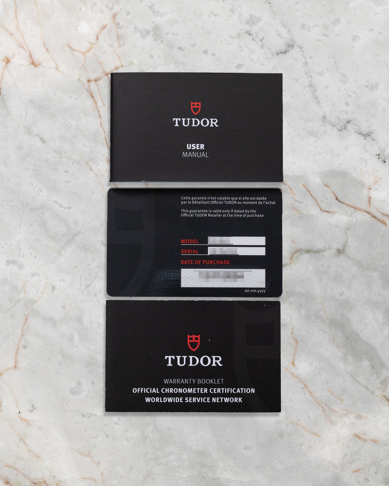 Original Tudor user manual, guarantee booklet, and official international warranty card for the pre-owned 2024 Tudor 1926 M91351.