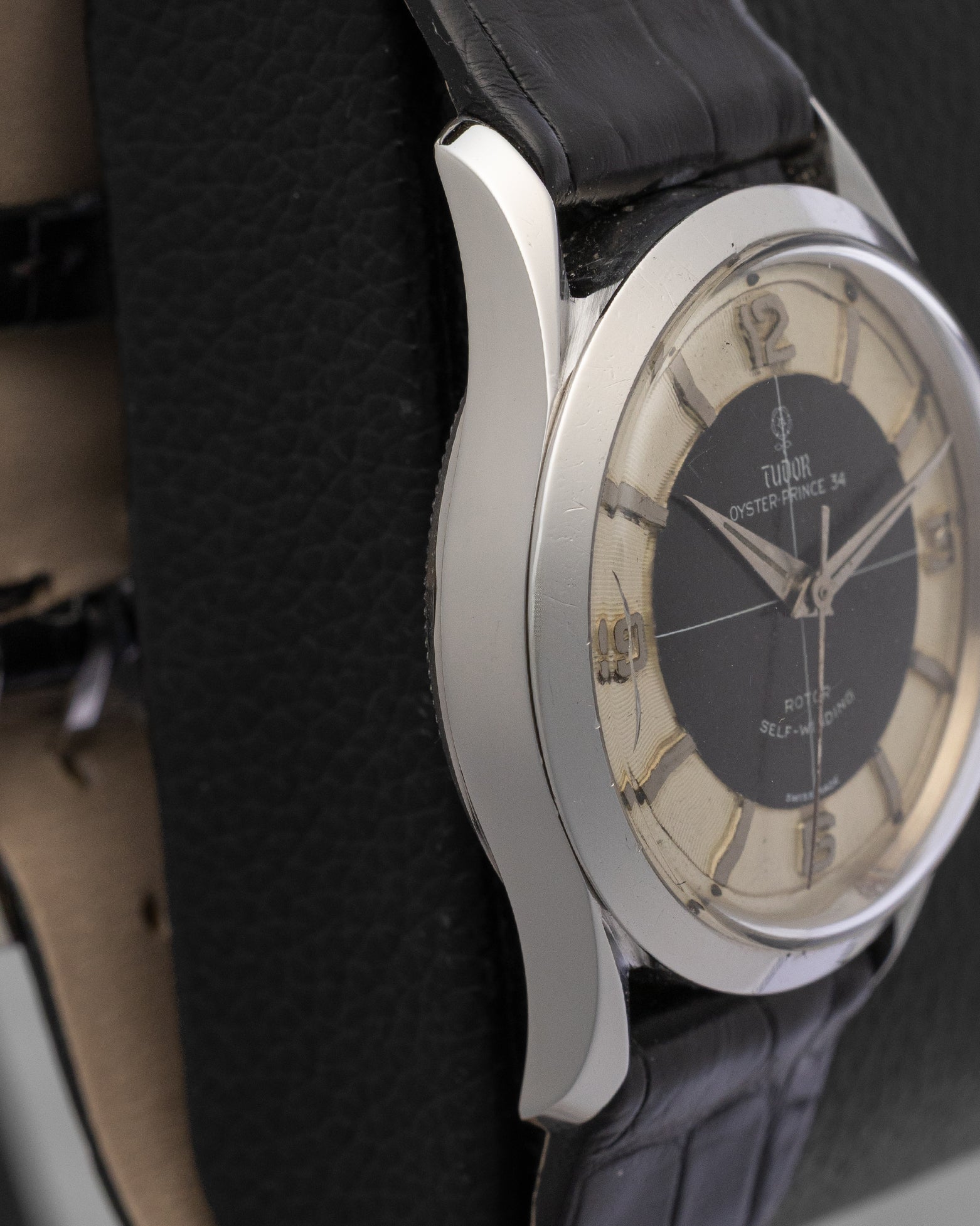 left non-crown side profile view of the vintage 34mm Tudor Oyster Prince case showcasing its brushed case finish and sleek lug profile