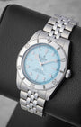 angled profile view of a 2025 Tudor Black Bay 54 reference M79000-0001 showcasing the textured light blue dial and five-link stainless steel bracelet